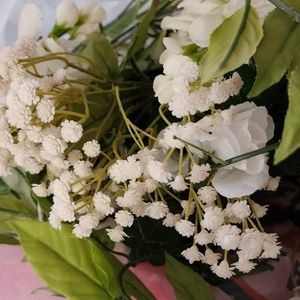 Alot of wedding flowers . Pink and white.